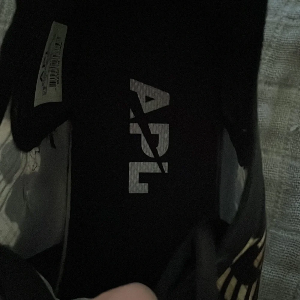 APL Leopard Print Athletic Sneakers in Black and Tan